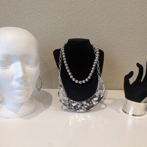 Set of statement costume jewelry pieces, silver earrings, necklaces, + bracelet